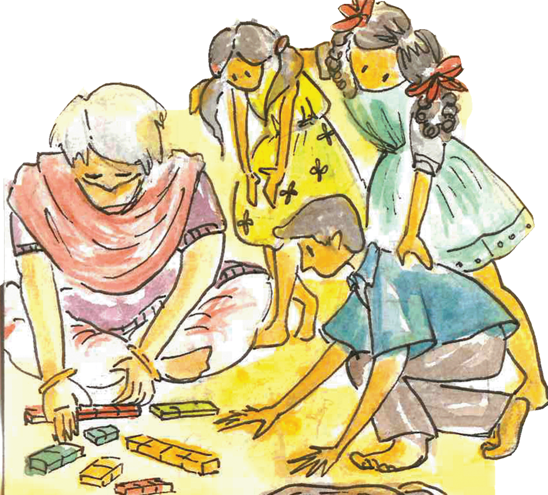 Meenakshi sits on the floor with children, building with wooden blocks together.